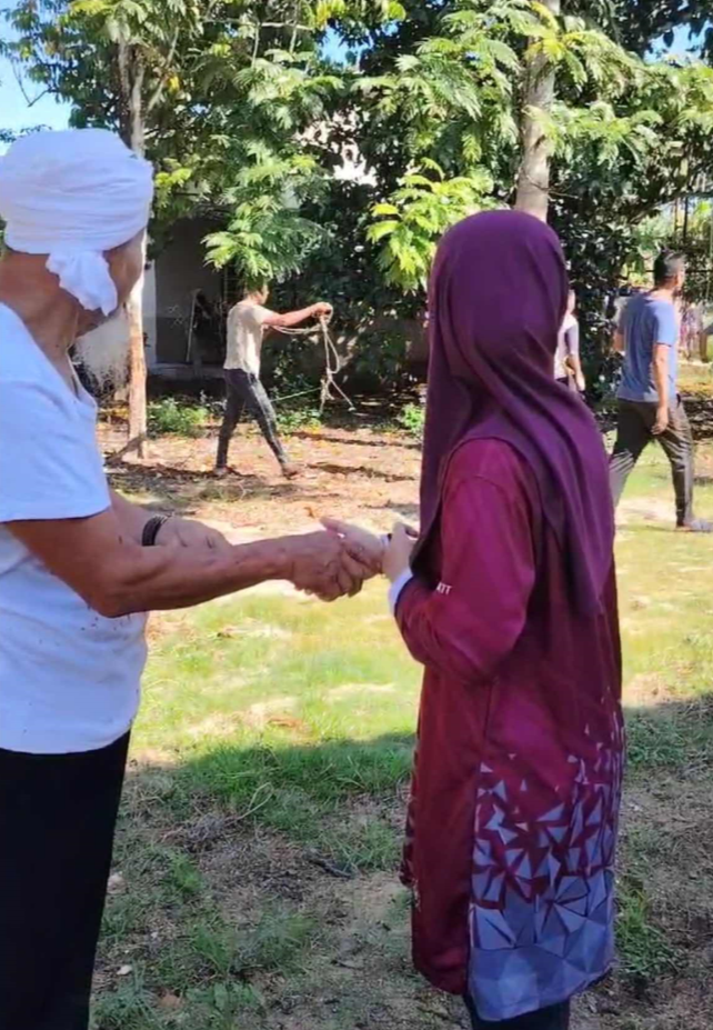 msian looking at the moment where their cow escapes