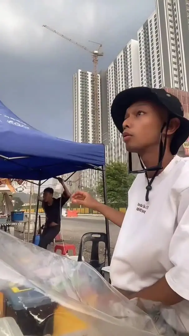 msian looking shocked after his canopy flies away