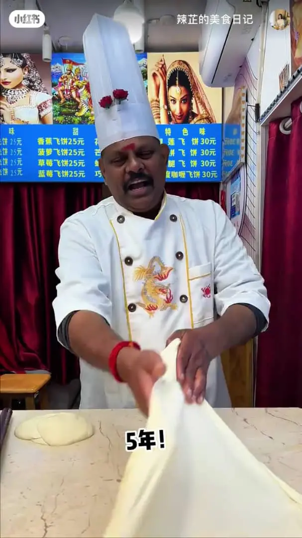 msian making roti canai