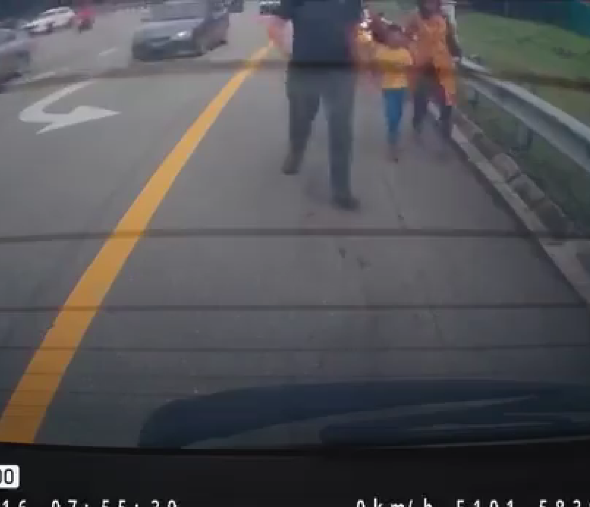 msian man bringing the wife and kid to his car for a ride