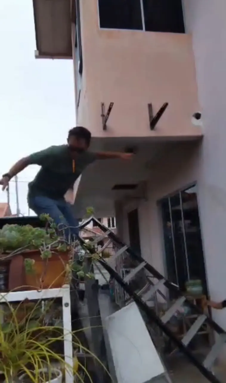msian man falling down from the ladder