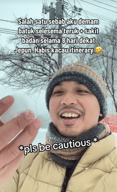 M'sian man holds a snowball in Japan