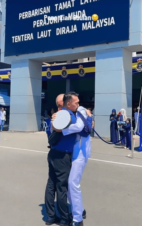 M'sian man hugs father