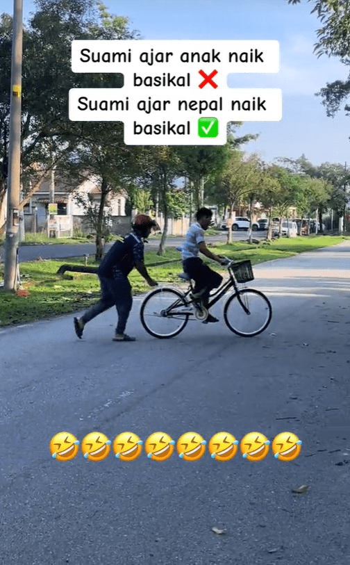 M'sian man pushes bike for Nepali man