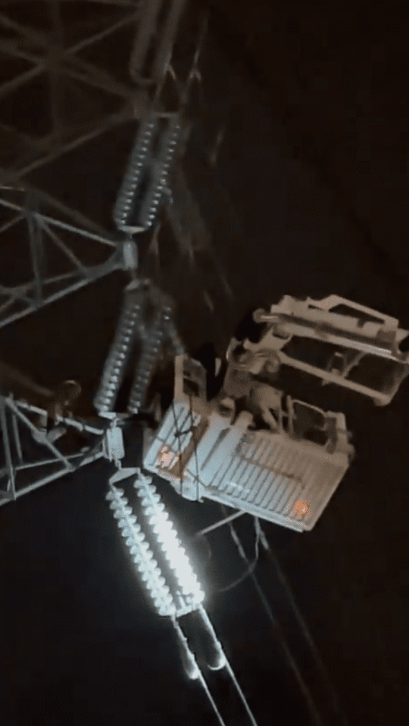 M'sian man on top of transmission tower
