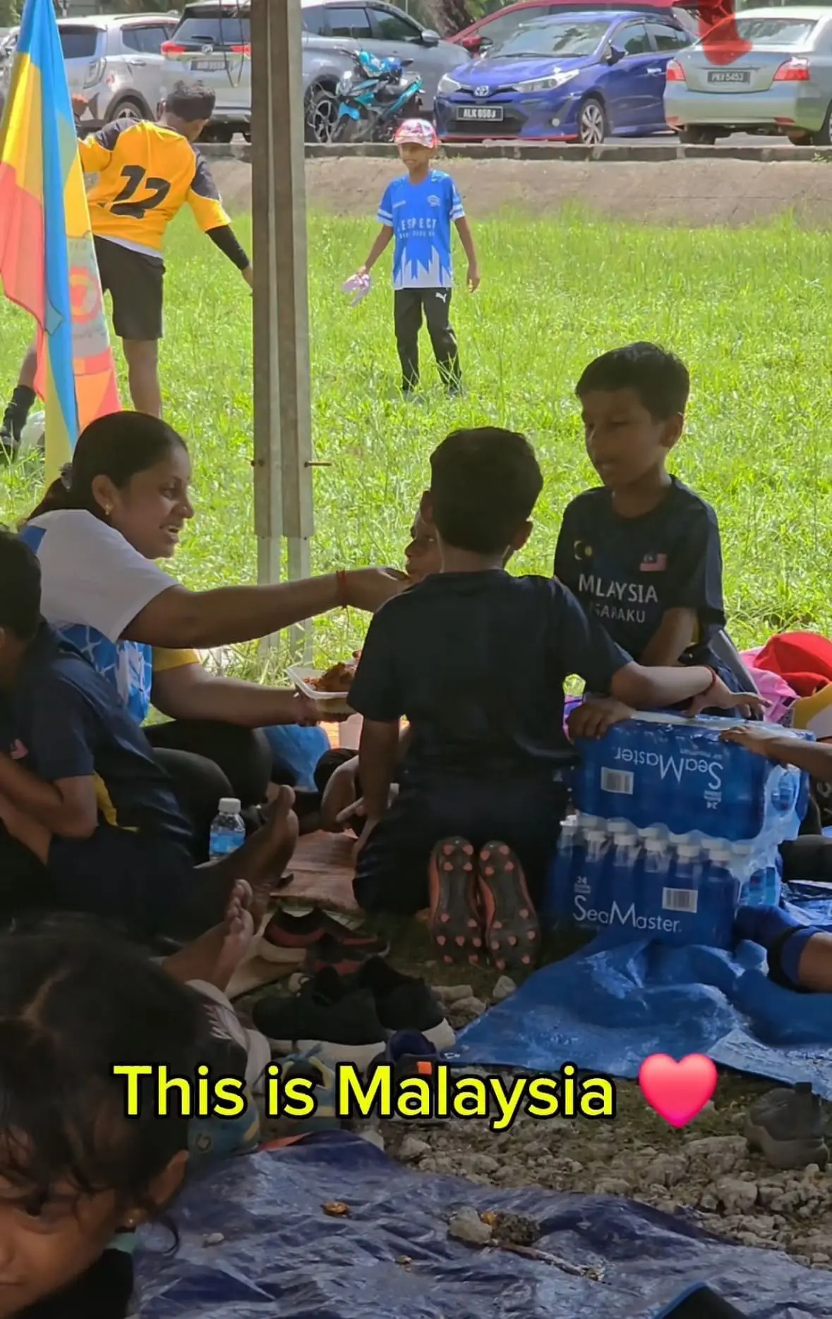 M'sian Teachers Touch Hearts By Lovingly Feeding Students During Football Tournament