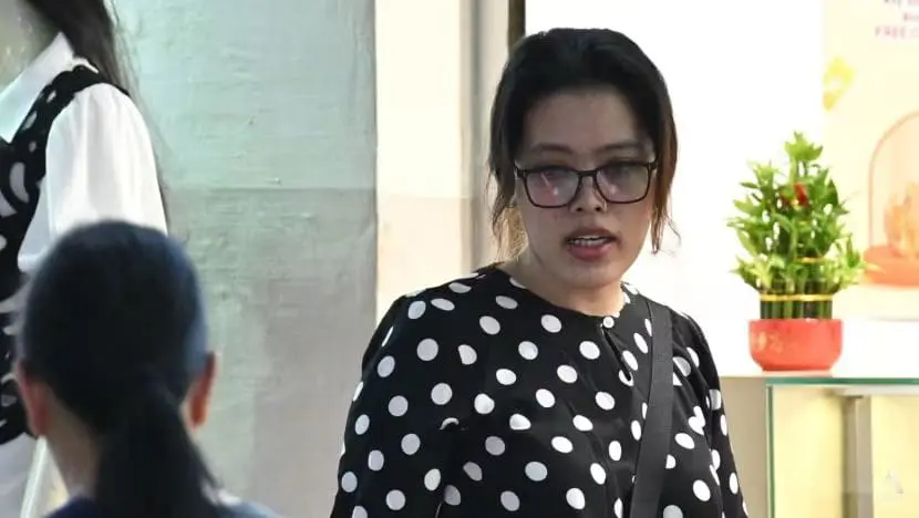 msian woman outside a court in singapore