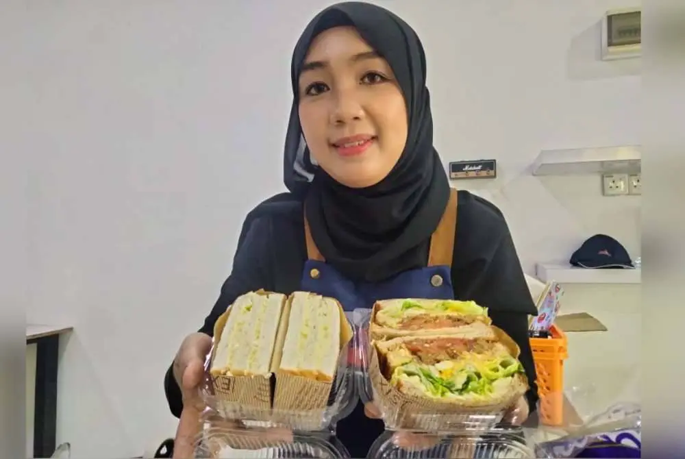 msian woman showing sandwiches she just made