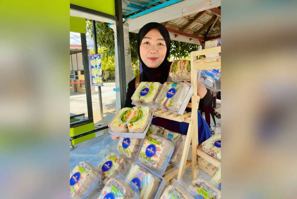 msian woman showing the sandwiches she made for business