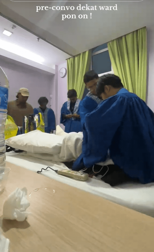 M'sians help friend put on graduation robe inside hospital