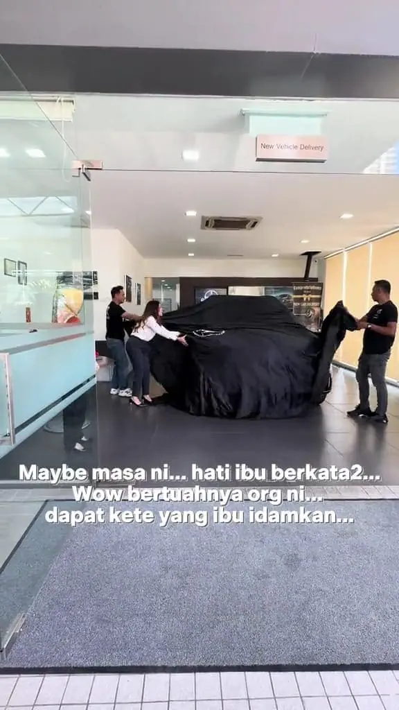 msians taking a black cloth from a car