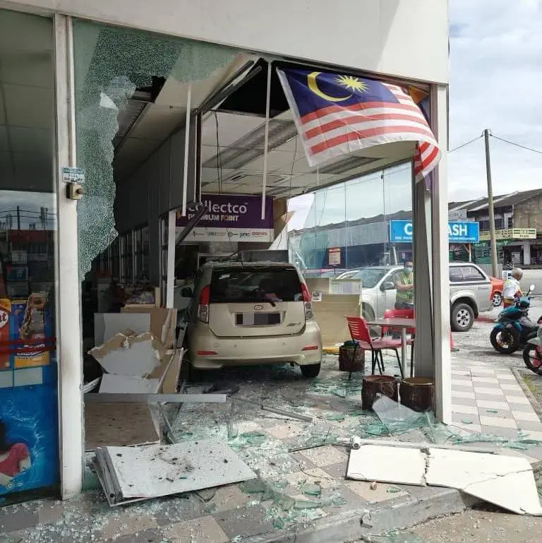 Myvi crashes into petrol station shop in Ipoh