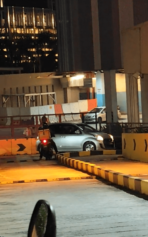 Myvi tries to get out of motorcycle entrance at Setia City Mall