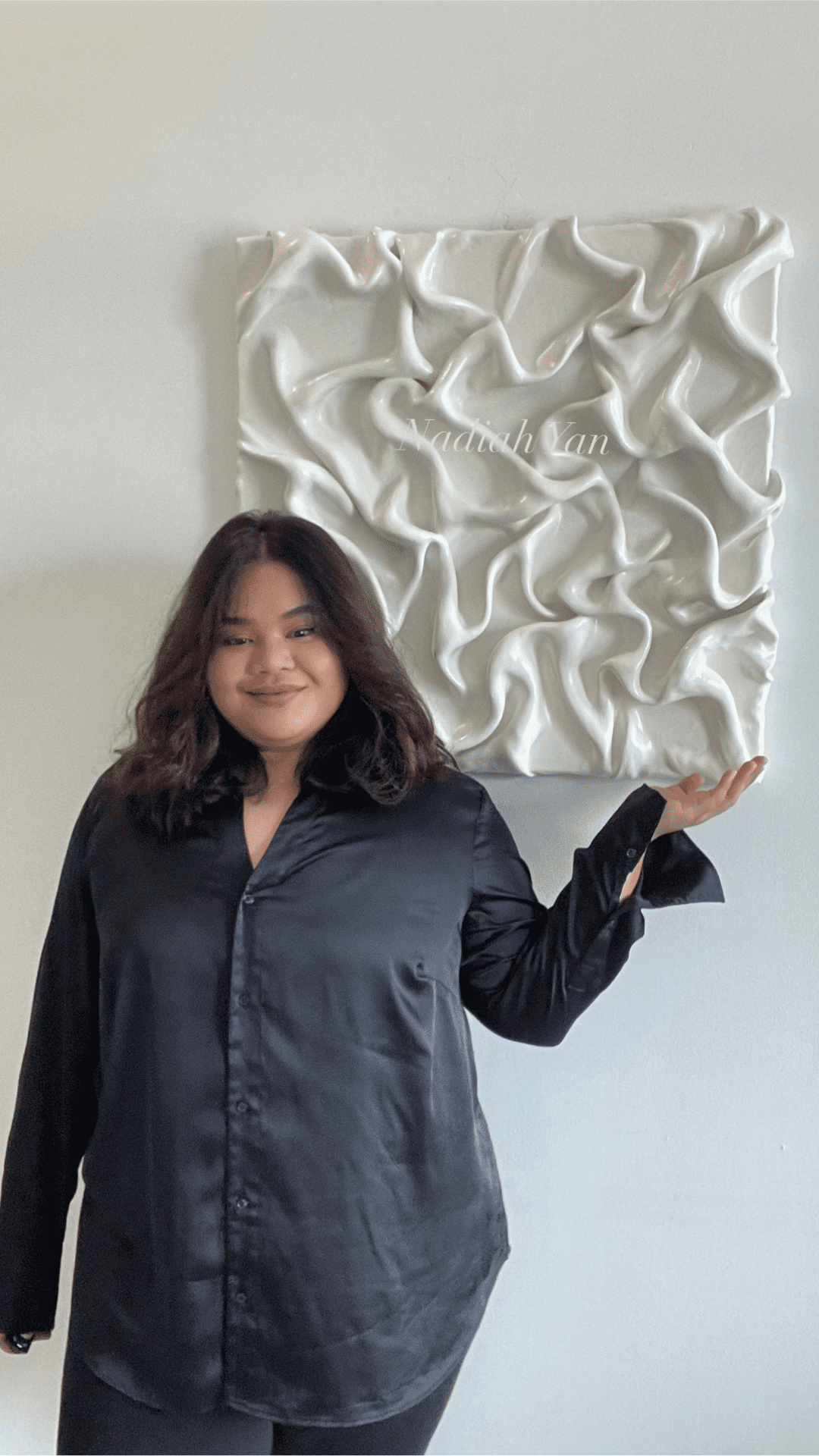 Nadiah Yan, with one of her abstract paintings