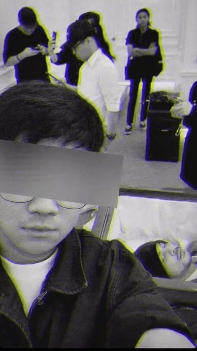 Namewee lies inside a coffin