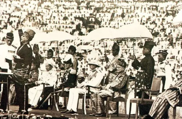Tunku Abdul Rahman upping hand up high.