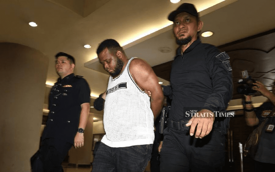 Obianke escorted by police