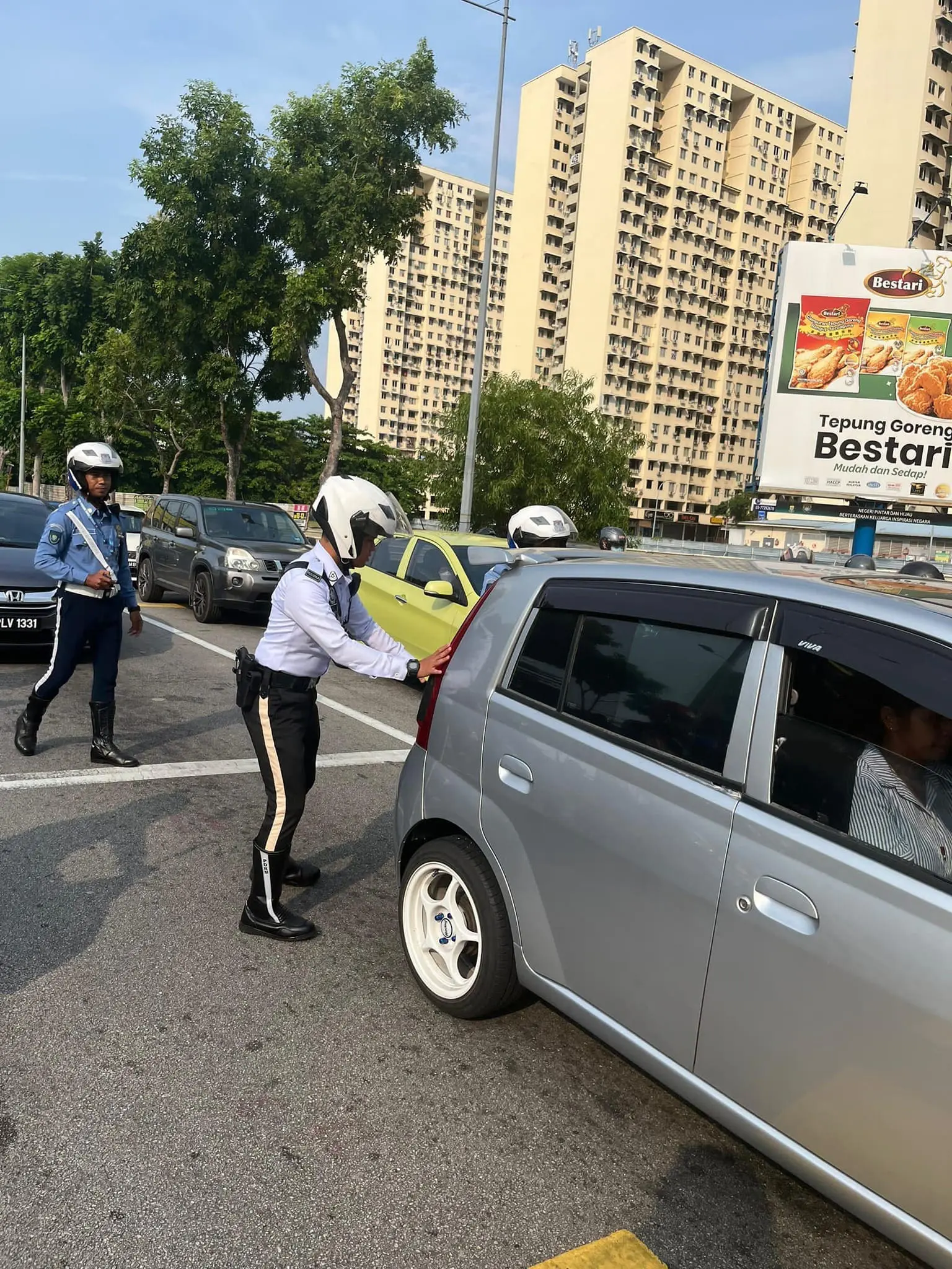 Officer pushing the car