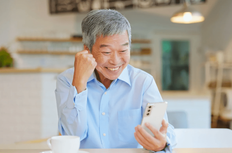 old asian uncle looking happy