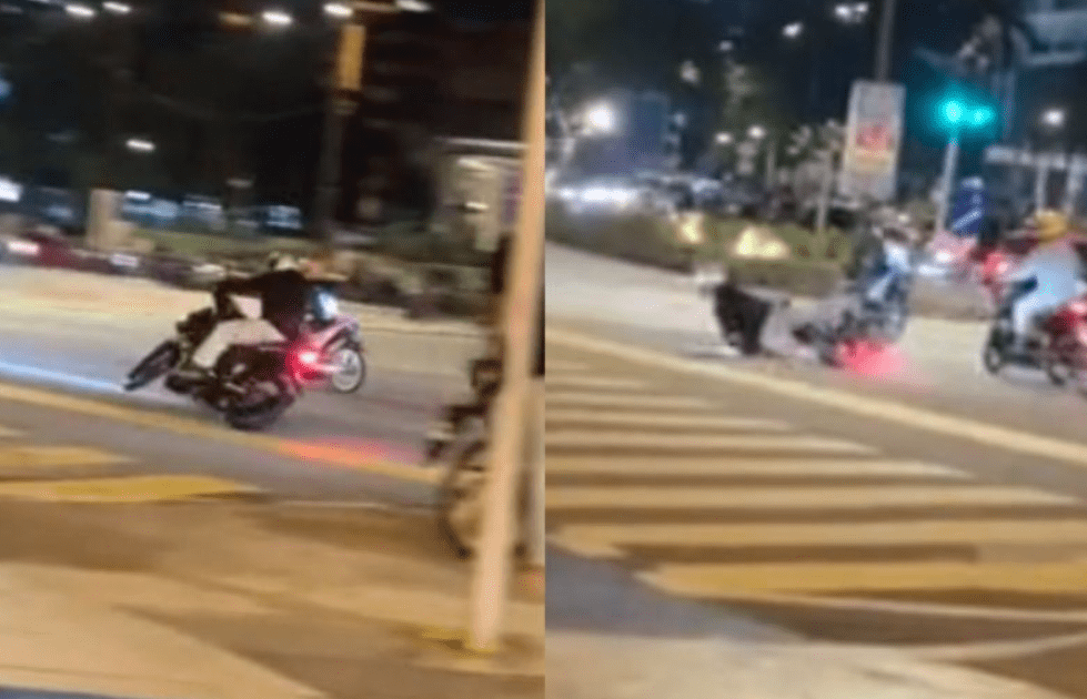'Mat Rempit' falls down while doing a wheelie near KLCC