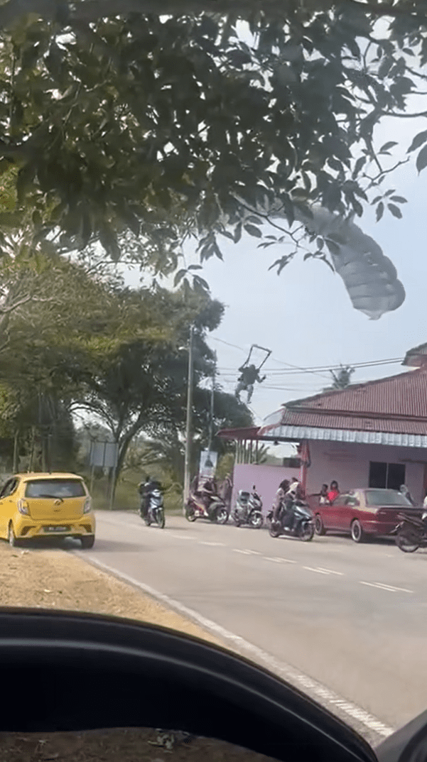 Paratrooper descending from the sky