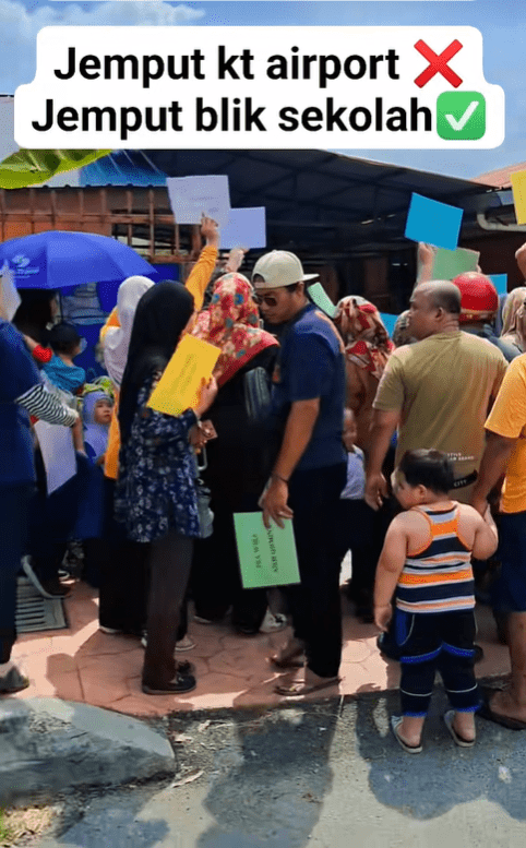 Parents holding placards