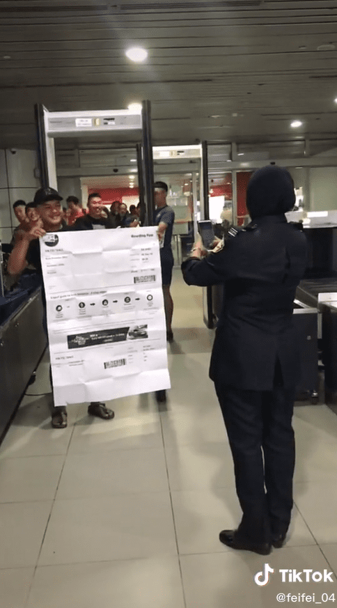 Man Shows Up At Sabah Airport With Huge Boarding Pass & It's Hilarious AF