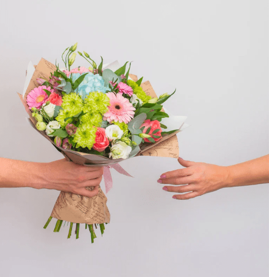 person giving flowers
