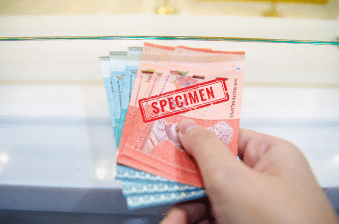 Person placing RM at counter