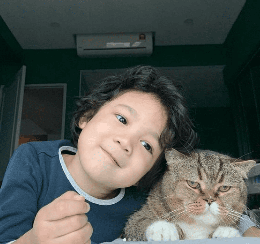 Kid with his furry friend