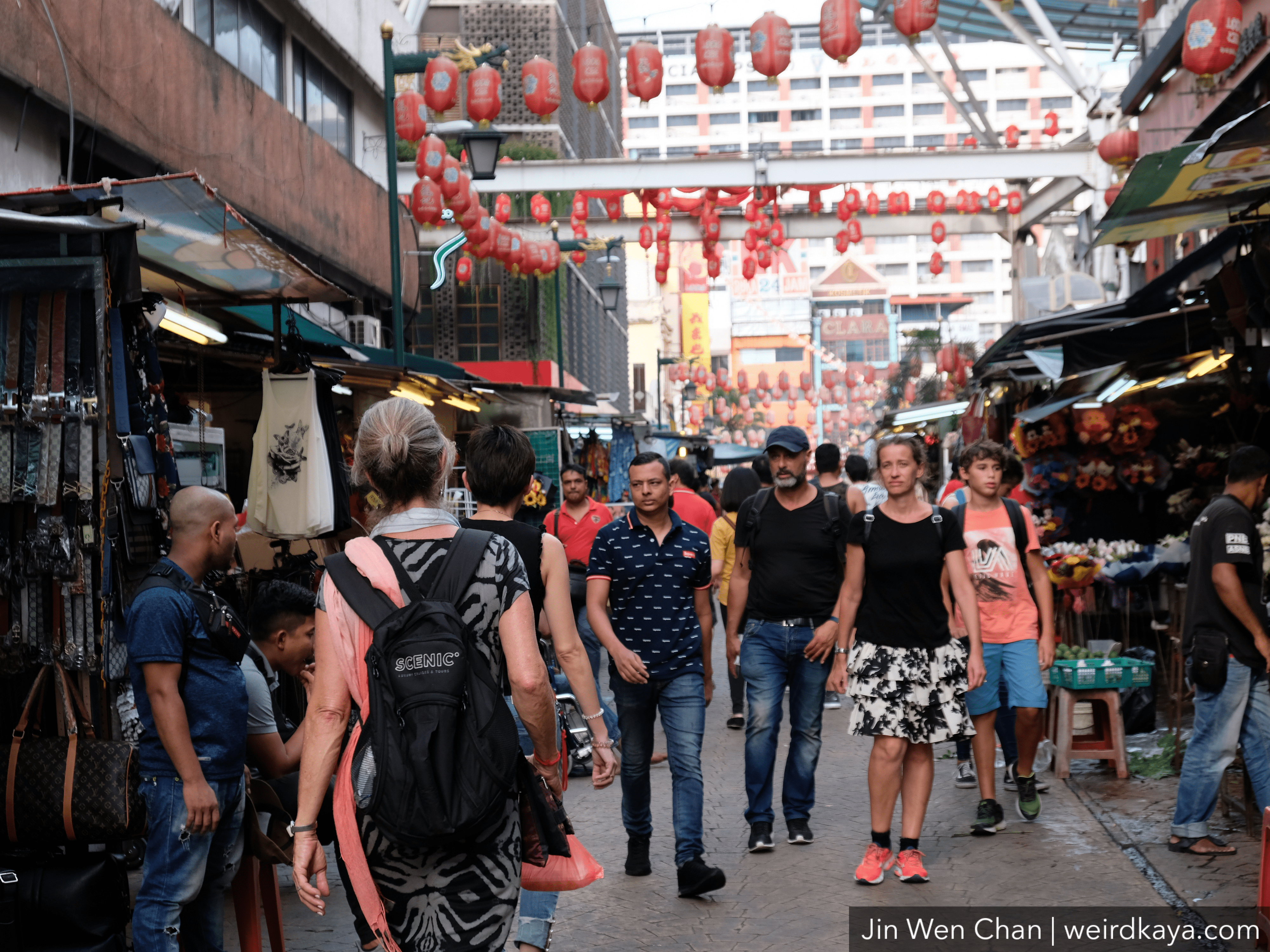 Tourists walking around Petaling Street