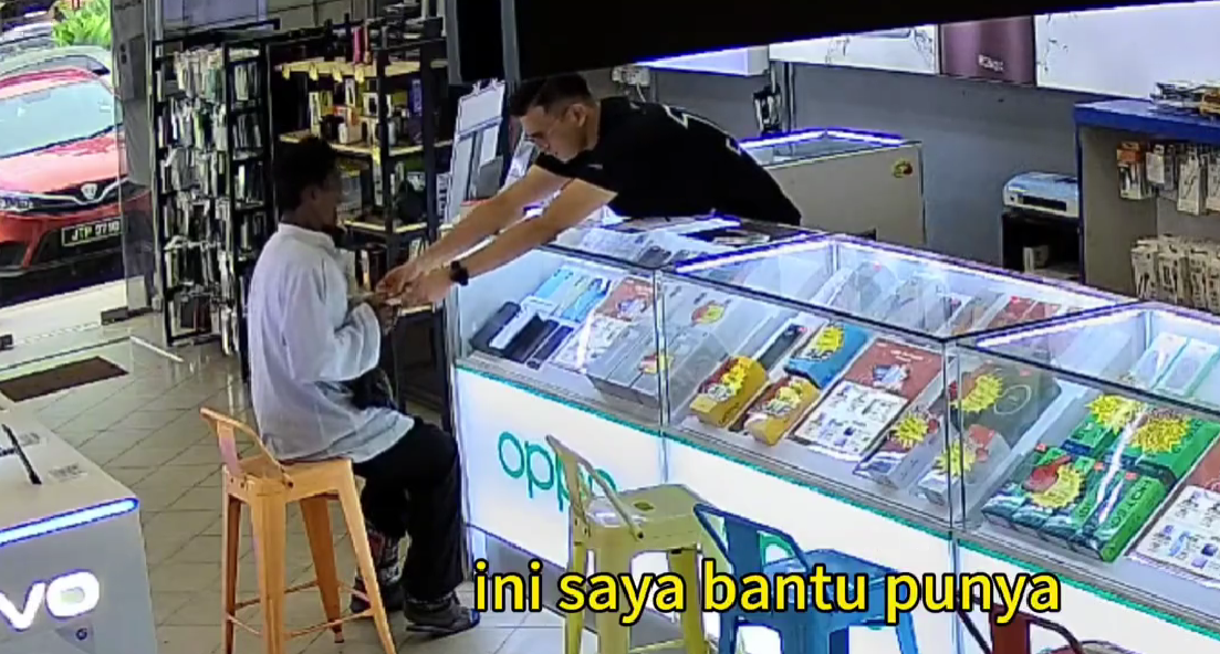 phone shop owner giving money to elderly