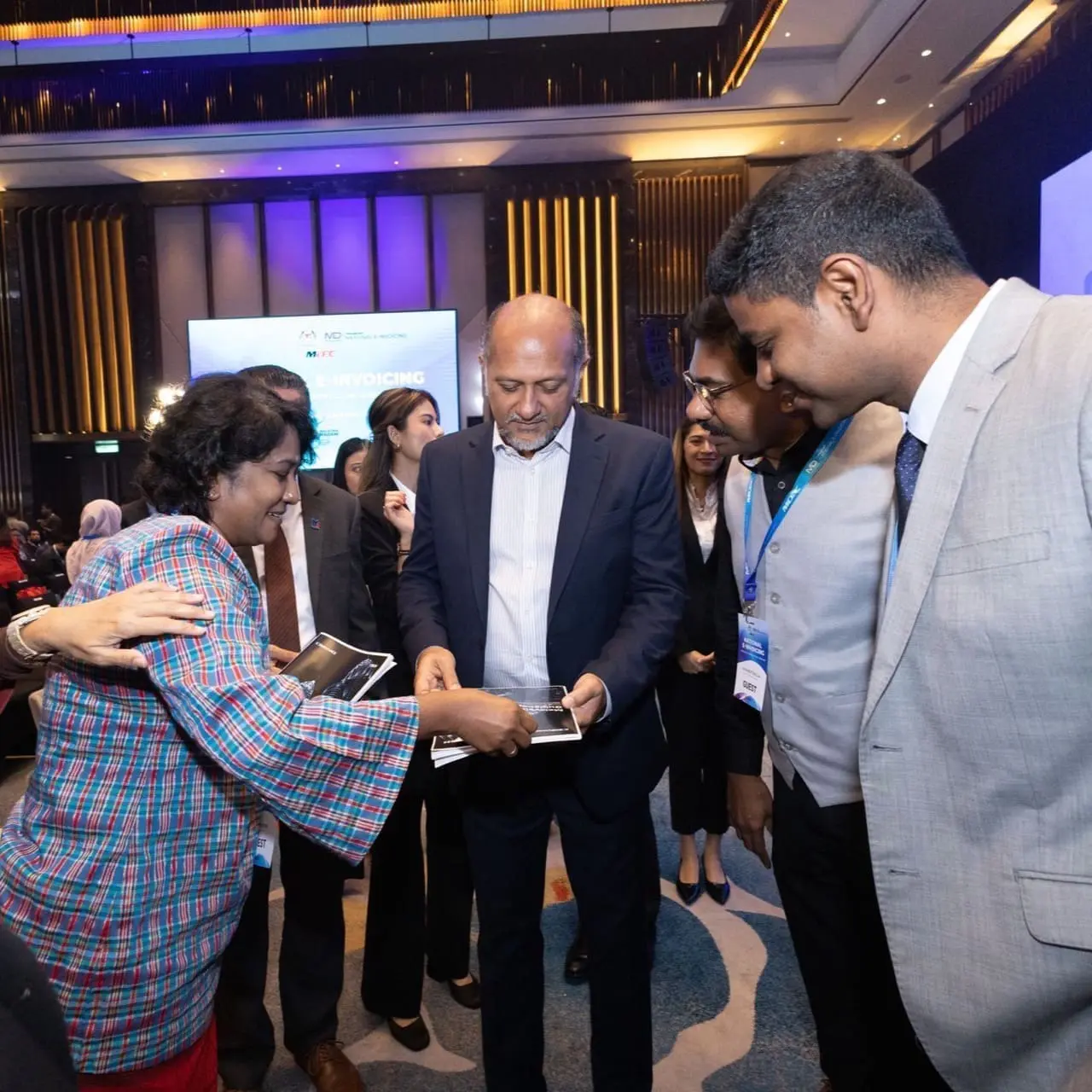 Complyance e-invoicing booklet presented to Digital Minister of Malaysia Mr. YB Gobind Singh Deo.