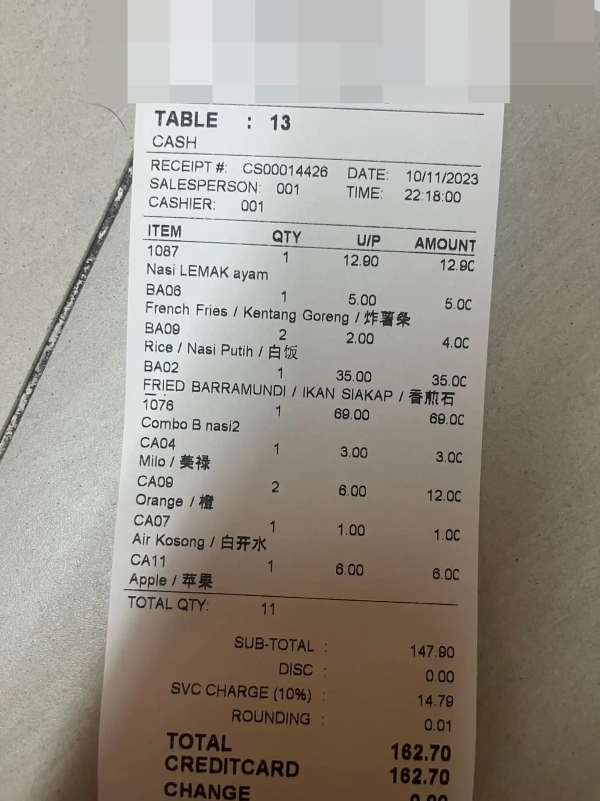 Restaurant owner showing another customer's receipt 