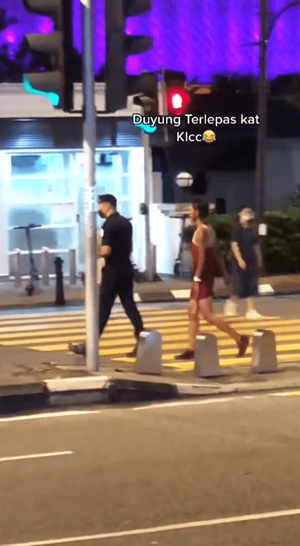Woman In A Short Dress Swims Inside Water Fountain Near KLCC, Bystanders Yell ‘Out!’ At Her