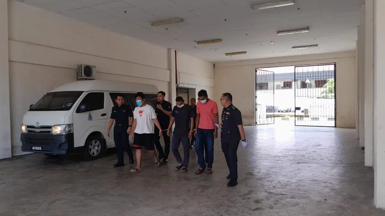 Police bringing accused out frm the court