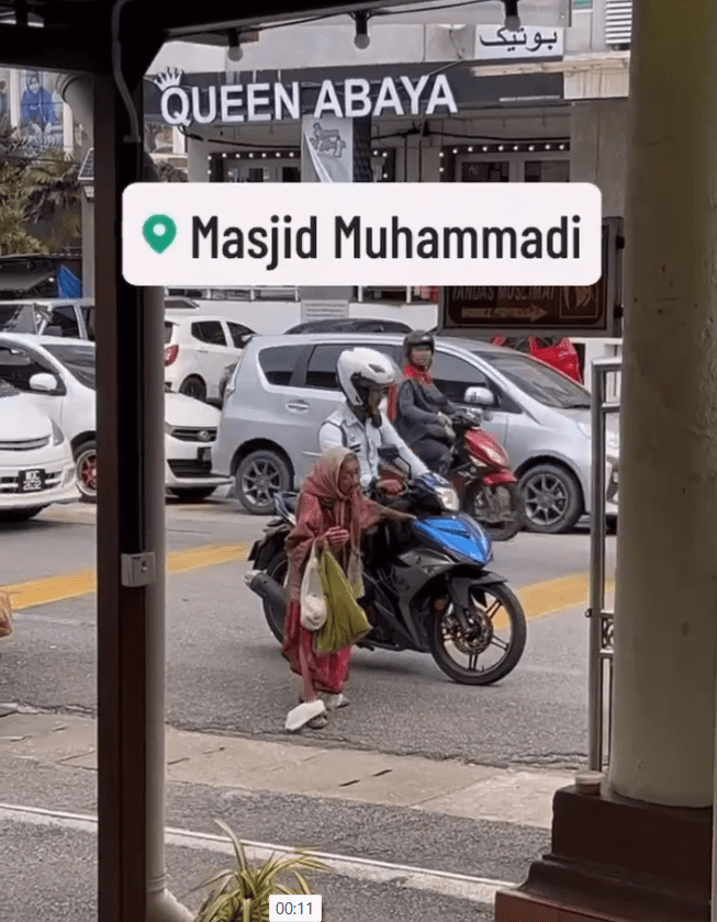police officer driving away after helping an elderly woman