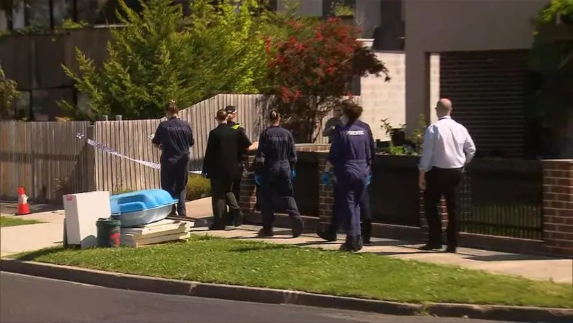 Police officers at KC Leong's house