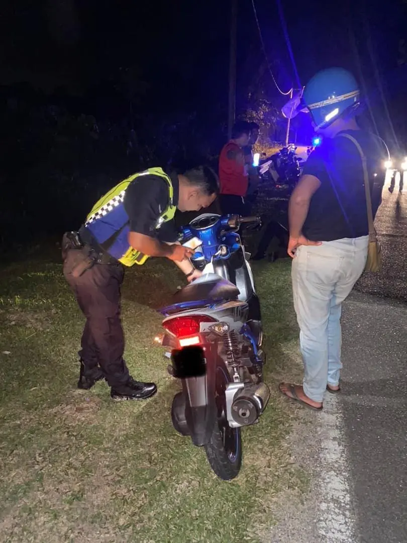 police officers checkign the motorcycle