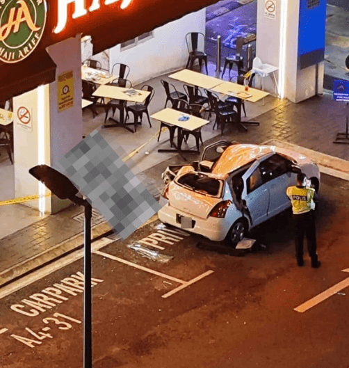 Police standing near victim's body in KL