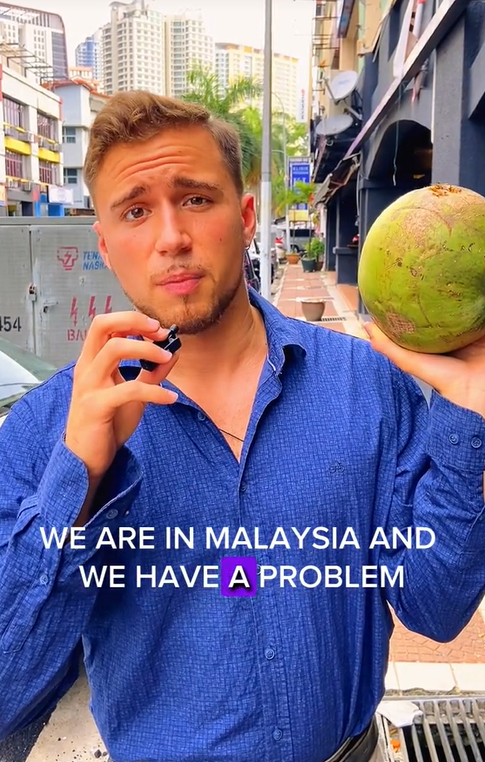 Mat Salleh Tries To Open Coconut With His Teeth In M'sia But Ends Up Cracking It