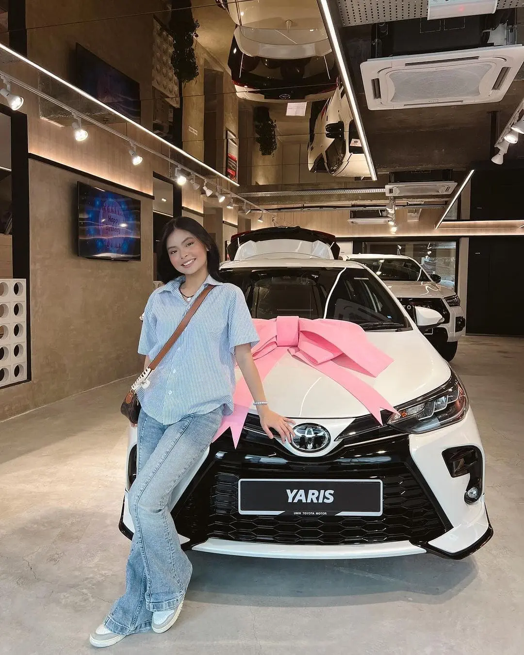 Qistina Raisah with her new Toyota Yaris