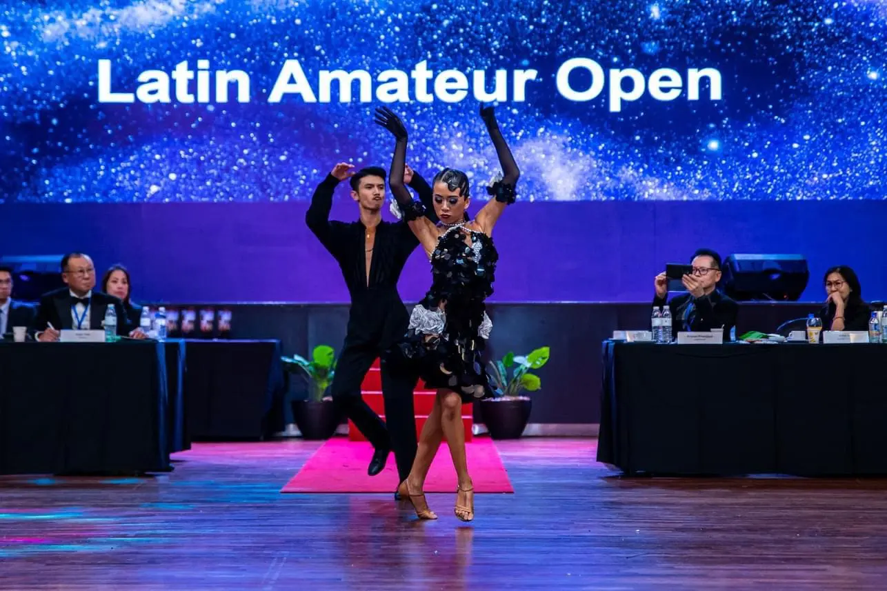 Reegyn and her partner in front of the judges