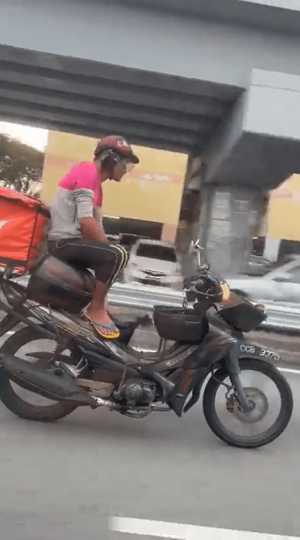 M'sian Delivery Rider Seen Riding Motorbike With No Hands, Nabbed By Police For Endangering Public Safety