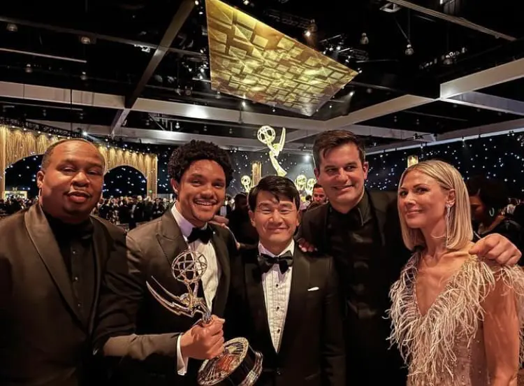 Ronny Chieng posing for a photo with 'The Daily Show' team