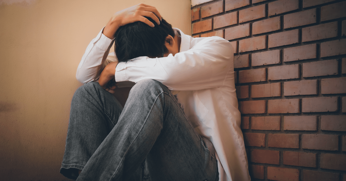 sad man sitting on the floor