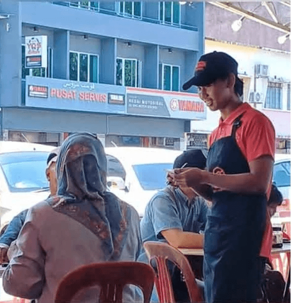 Said Syazwan Said Rosnizam working at a restaurant