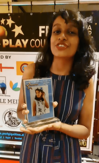 Heerraa Ravindran showing off her award 