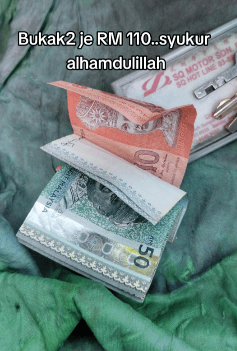 M'sian Delivery Rider Saves Cat From Reversing Car, Driver Rewards Him With RM110 For Good Deed