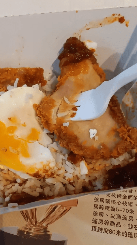 Msian trying to break apart the hard-like Mc Donald's Spicy Chicken